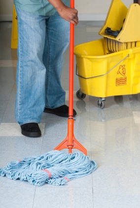 All Season Floor Pros janitor mopping floor